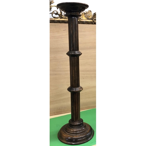 8164 - An oak torchere, 97cm high.