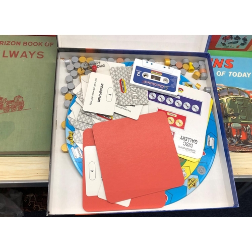 8166 - A quantity of jigsaw puzzles, board games, model kits and 4 railway books.