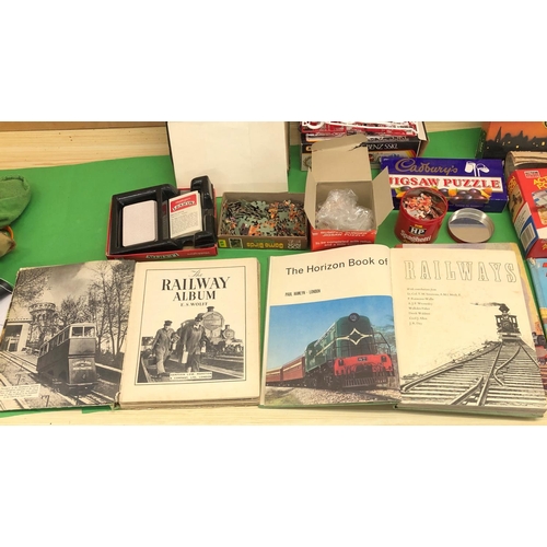 8166 - A quantity of jigsaw puzzles, board games, model kits and 4 railway books.