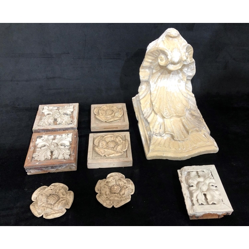 8169 - A plaster wall bracket and 7 plaster moulds.