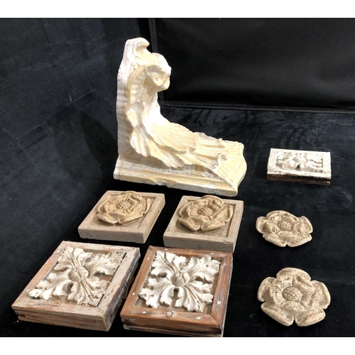 8169 - A plaster wall bracket and 7 plaster moulds.