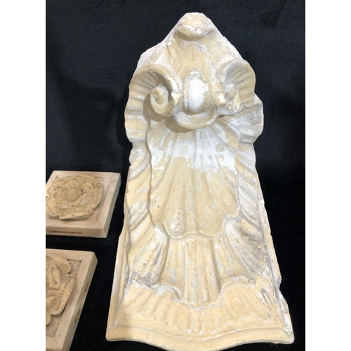 8169 - A plaster wall bracket and 7 plaster moulds.