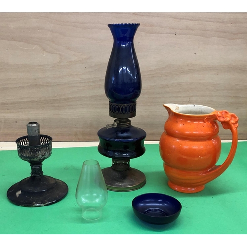 8170 - An orange glazed jug and 2 lamps.