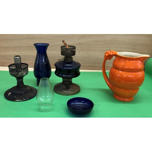 8170 - An orange glazed jug and 2 lamps.