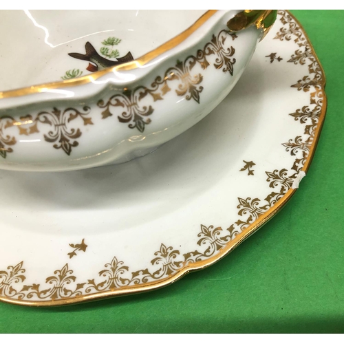 8171 - A set of 12 Limoges fish patterned dinner plates, gravy boat (1 edge chip)and platter, 10 Sutherland... 