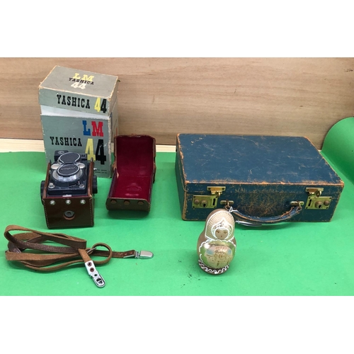 8180 - A Yashica 44 twin lens camera in leather case and with original box, a blue leather jewellery box an... 