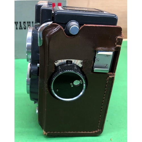 8180 - A Yashica 44 twin lens camera in leather case and with original box, a blue leather jewellery box an... 