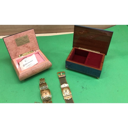 8191 - 2 Sorrentino musical jewellery boxes and 2 ladies watches.