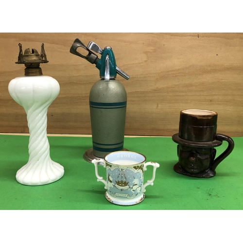 8192 - 1 milk glass parafin lamp base, WC Fields novely mug, Prince George mug and a vintage soda syphon.