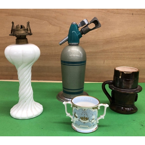 8192 - 1 milk glass parafin lamp base, WC Fields novely mug, Prince George mug and a vintage soda syphon.