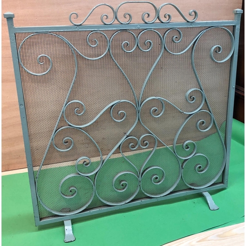 8196 - A green painted metal fire screen, 61cm wide, 61cm high.