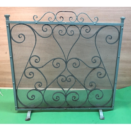 8196 - A green painted metal fire screen, 61cm wide, 61cm high.