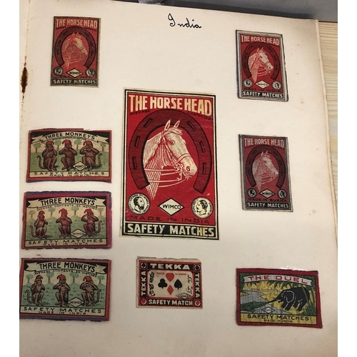 8064 - An album of match box covers and a quantity of loose matchbox covers.