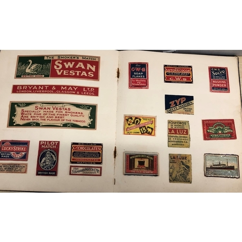 8064 - An album of match box covers and a quantity of loose matchbox covers.