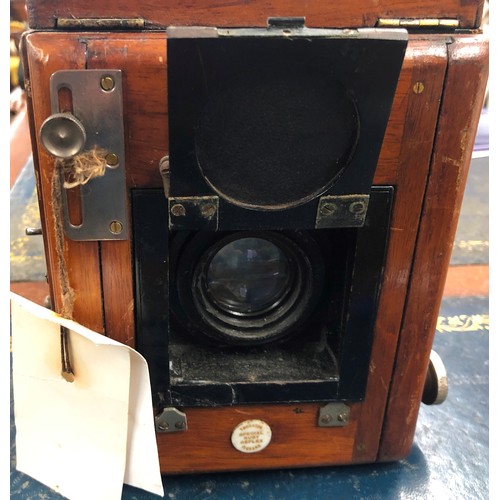 855 - Thornton Pickard mahogany box camera, a quantity of mahogany leather and other photographic plates e... 