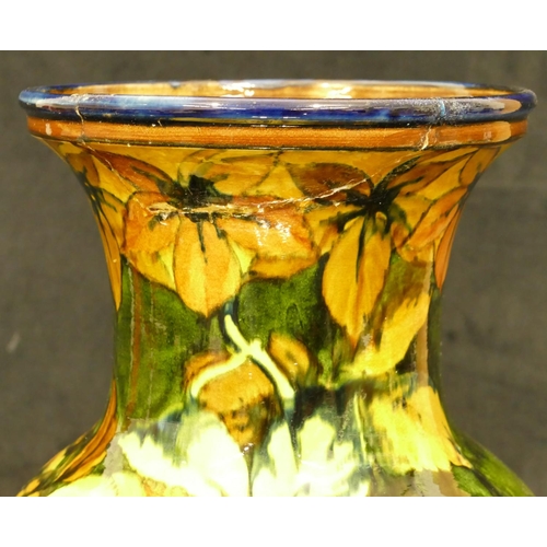 111 - A 19th Century glazed earthenware round bulbous thin necked trumped shaped vase on green and yellow ... 