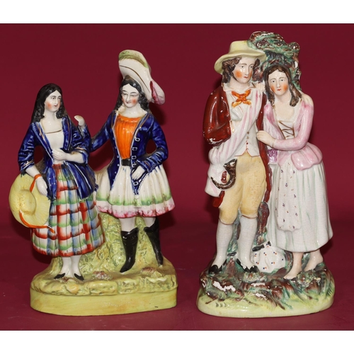 102 - 2 19th Century Staffordshire theatrical figures of a man and a woman, largest 25cm high (2)