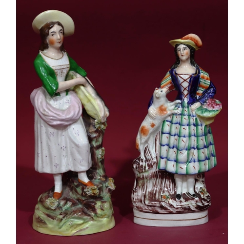 104 - A 19th Century Staffordshire figure of a lady with a rabbit, 30cm high and a 19th Century Staffordsh... 