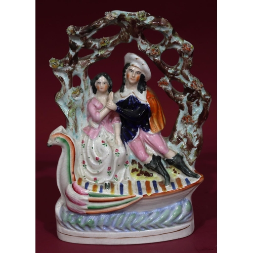 109 - A 19th Century Staffordshire group of a lady and gentleman standing in a boat under an arbour, 26cm ... 