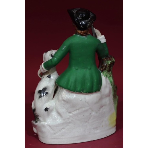 116 - A 19th Century Staffordshire figure by Thomas Parr of a huntsman and dog, 27cm high