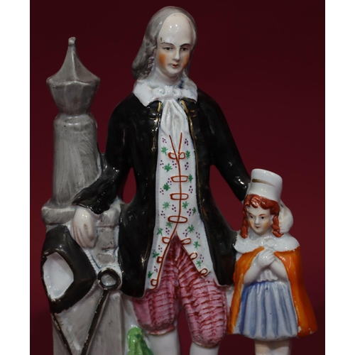 117 - A 19th Century Staffordshire figure of a man and child (possibly Paxton), 26cm high