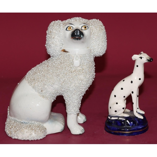 119 - A 19th Century Staffordshire figure of a seated poodle, 11cm high and a 19th Century Staffordshire f... 
