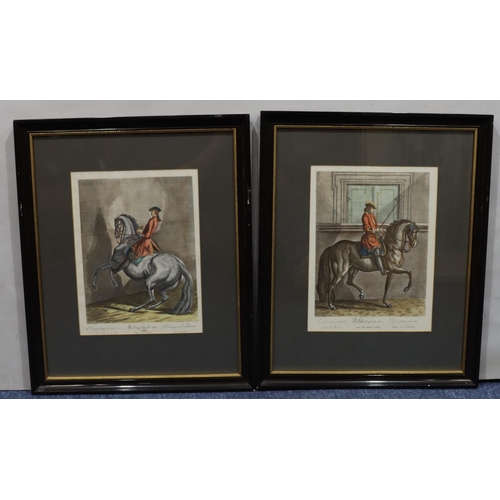 155 - A pair of Continental coloured prints of figures on horseback, in black and gilt frames, 32.5cm x 34... 