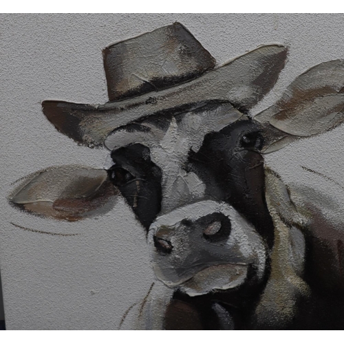 162 - A modern oil on canvas, portrait of a cow wearing a hat, unsigned, unframed, 80cm x 80cm