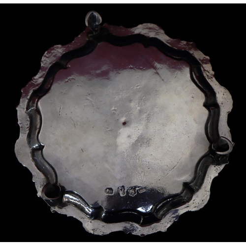 182 - A George II silver round pie crust card tray on 2 splayed hoof feet, with engraved crest, London 175... 