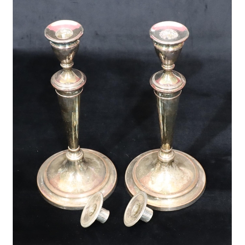 217 - A pair of Sheffield silver plated round candlesticks on turned stems and sweeping bases, 34cm high