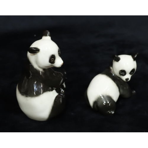 23 - 2 Russian Lomonosov porcelain figures of pandas, largest 13cm high (2)