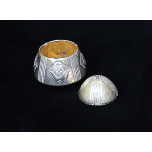 231 - A silver coloured metal round bulbous shaped salt with reeded and embossed scroll decoration, 6cm hi... 