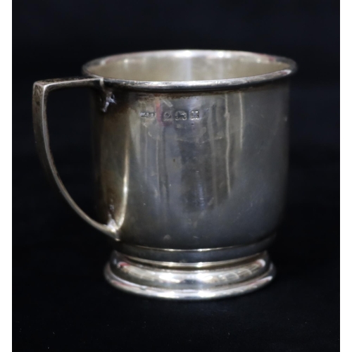 234 - A Birmingham plain silver christening mug on sweeping base (dented to 1 side), 2.1oz