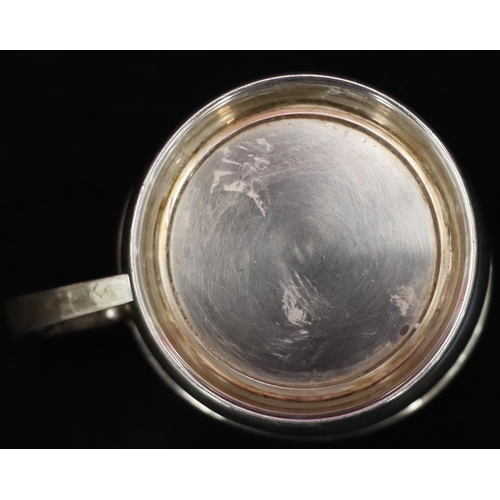 234 - A Birmingham plain silver christening mug on sweeping base (dented to 1 side), 2.1oz