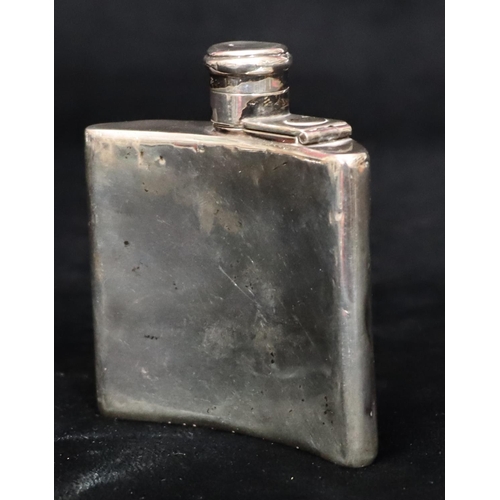 235 - A London small silver concaved shaped hip flask with screw hinged lid (dented but not split), 8cm hi... 