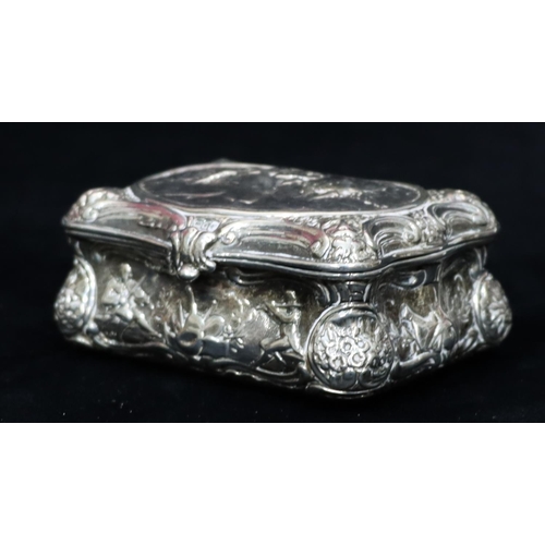 236 - A Continental imported silver rectangular scallop shaped snuff box with hinged lid and allover embos... 