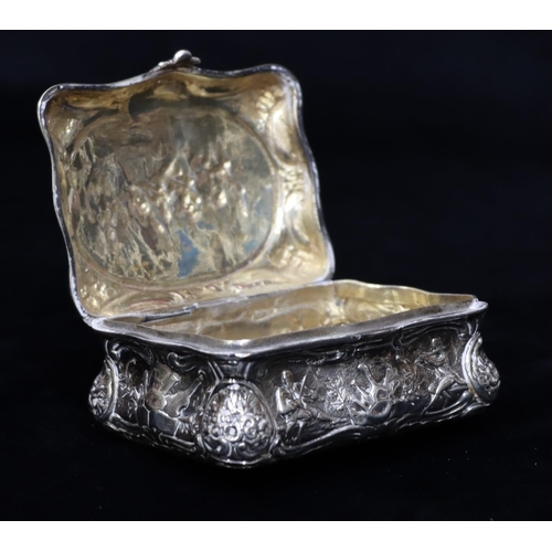 236 - A Continental imported silver rectangular scallop shaped snuff box with hinged lid and allover embos... 