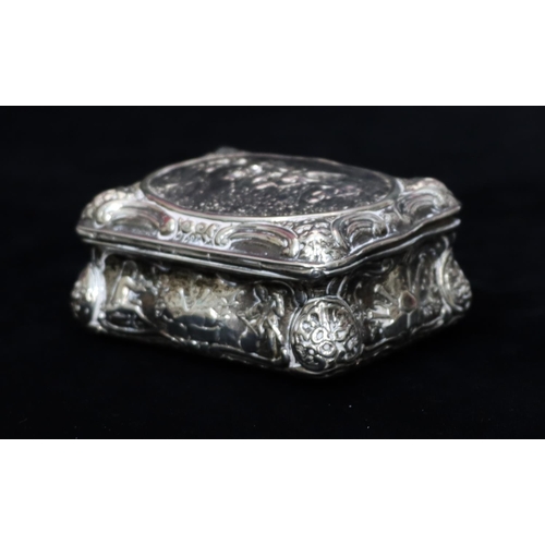 236 - A Continental imported silver rectangular scallop shaped snuff box with hinged lid and allover embos... 