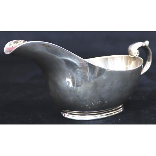 241 - A heavy Sheffield silver sauce boat with engraved presentation 