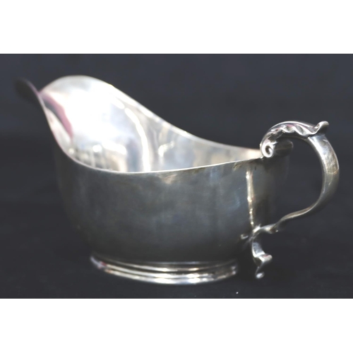 241 - A heavy Sheffield silver sauce boat with engraved presentation 