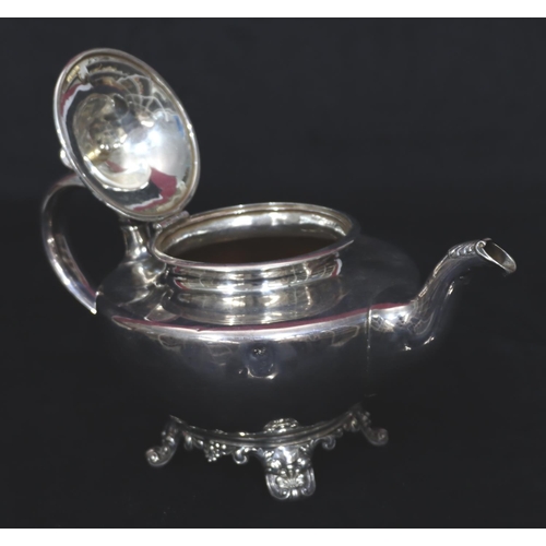 243 - An early Victorian silver round bulbous shaped teapot with scroll handle on splayed feet, London 184... 