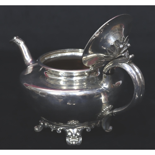 243 - An early Victorian silver round bulbous shaped teapot with scroll handle on splayed feet, London 184... 