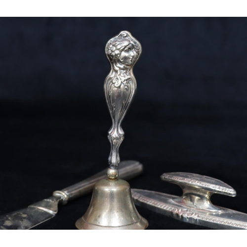 250 - A Sterling silver handled bell with embossed figurehead of a lady (bell later), a silver handled hor... 