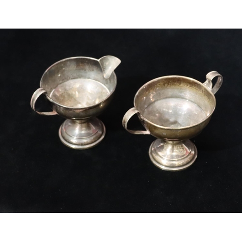 252 - El Il Co. Sterling Silver round 2-handled sugar bowl and matching cream jug on round weighted bases ... 