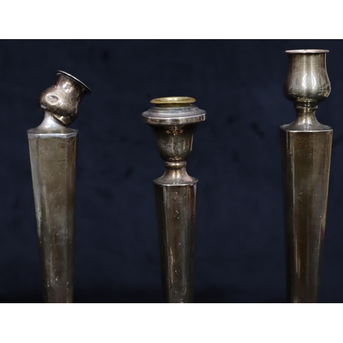 254 - 3 various similar Sterling silver candlesticks on tapering stems with round sweeping weighted bases ... 