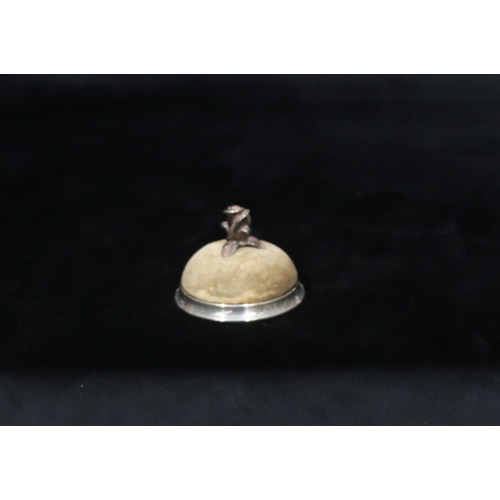 259 - Tiffany & Co Sterling silver small round bulbous shaped pin cushion with floral centre motif (nut to... 