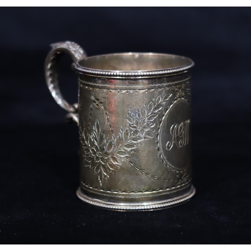 268 - A Victorian silver christening mug with ball rim and engraved floral and swag decoration, scroll han... 