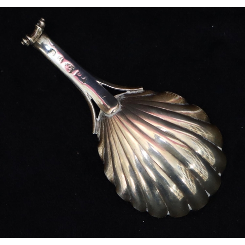 273 - A George III 18th Century silver caddy spoon with shell shaped bowl and scroll handle, London 1790 (... 