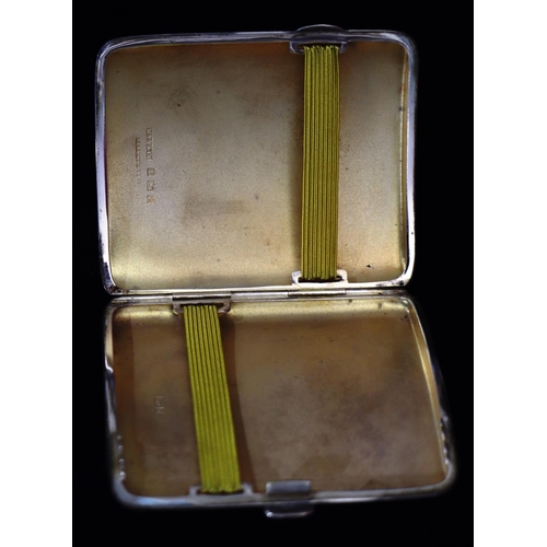 277 - A Birmingham silver concaved shape cigarette case with allover engine turned decoration, 3.1oz