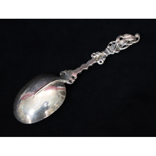 279 - An 18th Century Continental silver coloured metal marriage spoon with figure motif, engraved to back... 